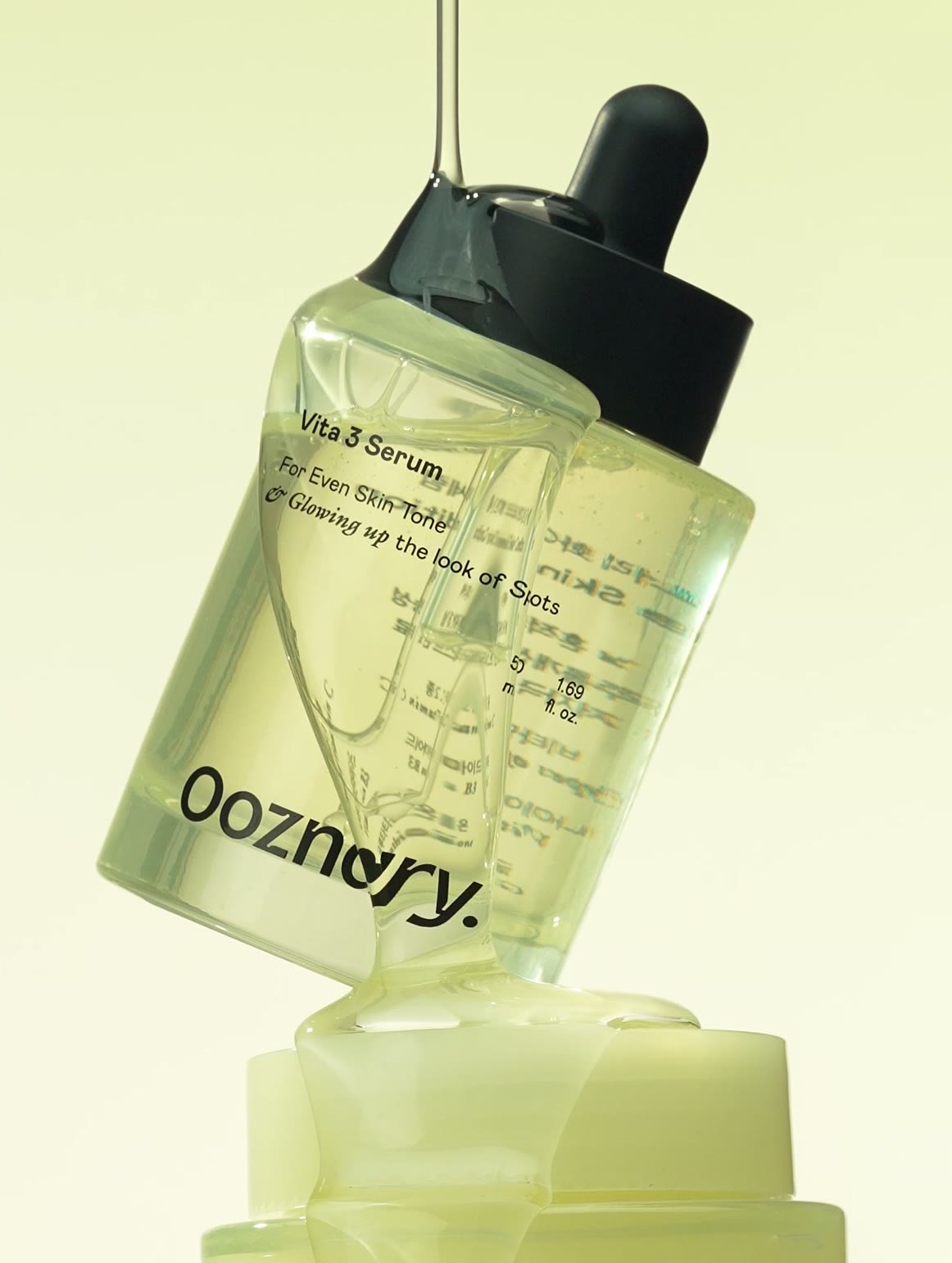 OOZNARY Vita 3 Serum bottle on a soft cream backdrop